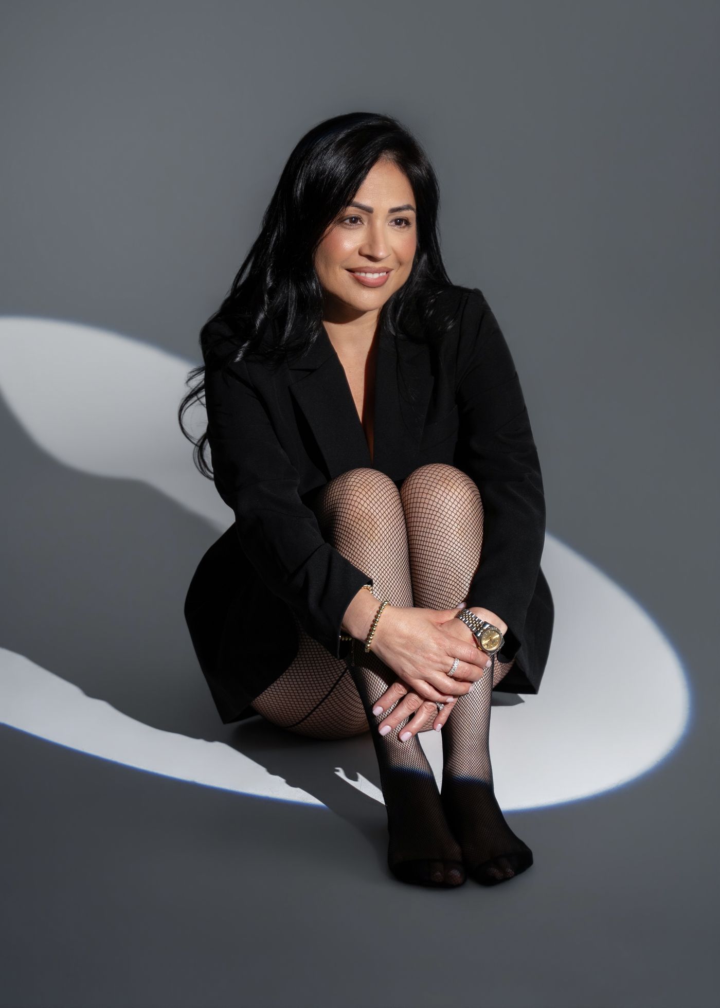 Branding portrait seated in a spotlight