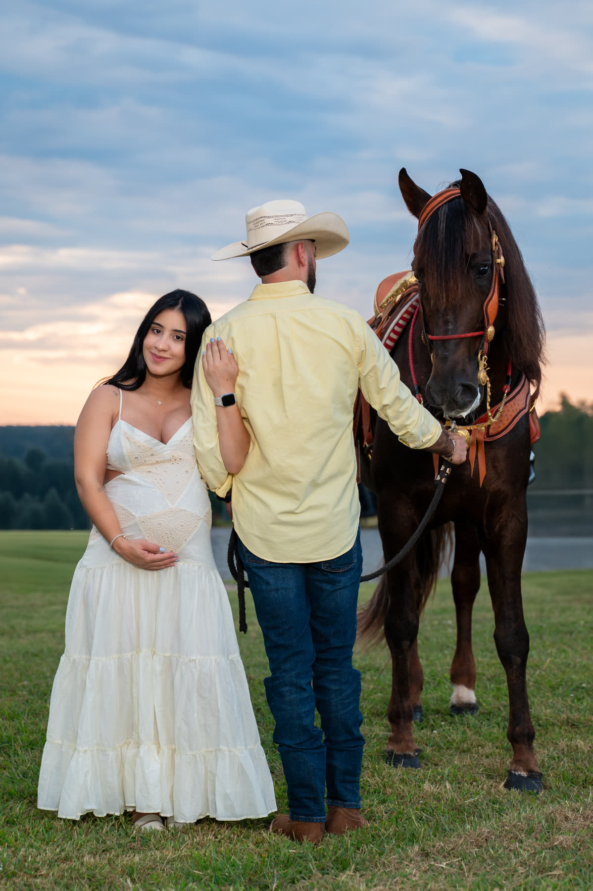 Outdoor maternity session at sunset with a horse